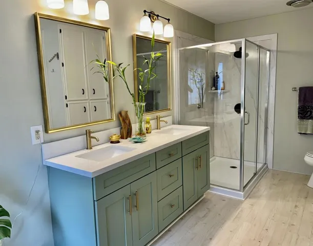 Upgraded Bathroom with new plumbing for double sink vanity and shower enclosure.