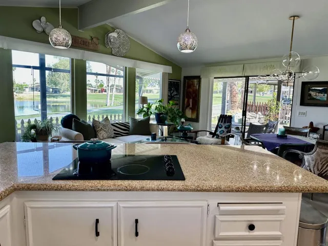 This multi living space has a lofty cathedral ceiling & golf views that nurture the soul!