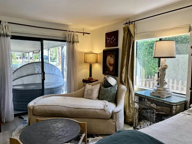 Large BR to accommodate retreat seating & a sliding door to a covered patio area.