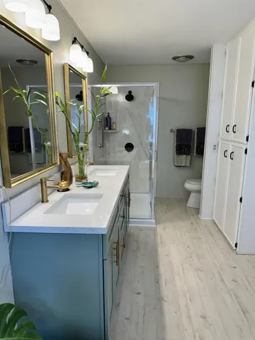 Double sink & shower updated Bathroom Suite, with a large linen closet and garden bathtub