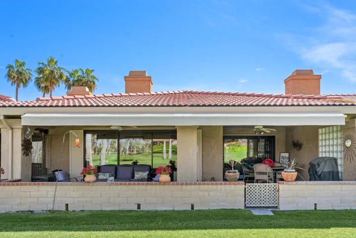 Enclosed back patio and remote awning