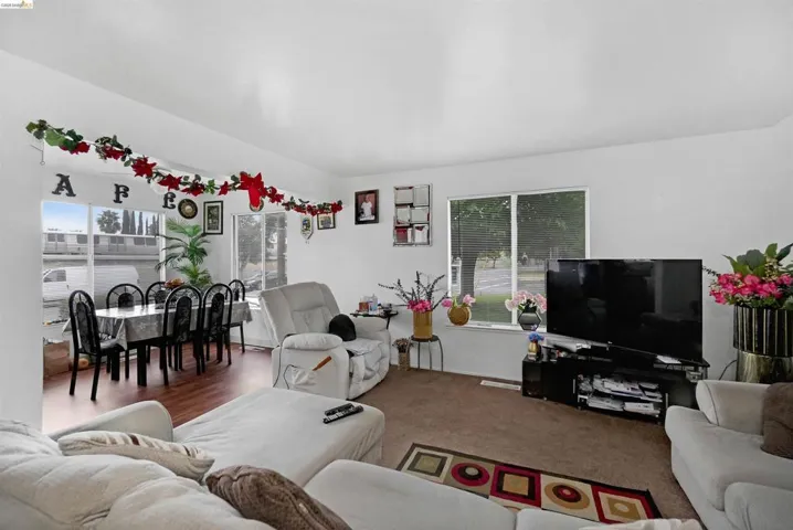 Living area featuring carpet flooring