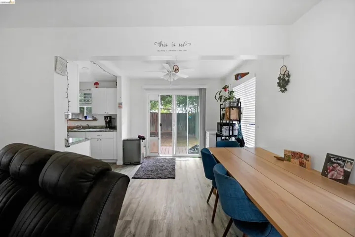 Dining room featuring light wood-type flooring and a ceiling fan