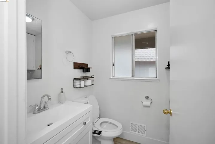 Half bath with vanity and toilet