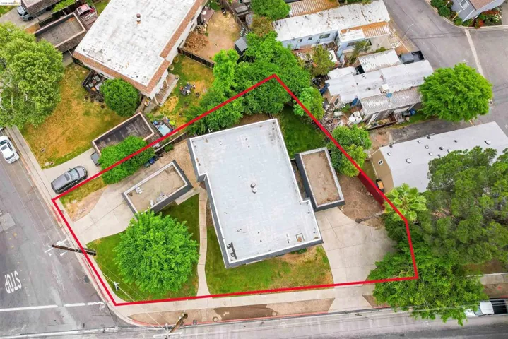 Aerial view of property and surrounding area with property boundaries highlighted