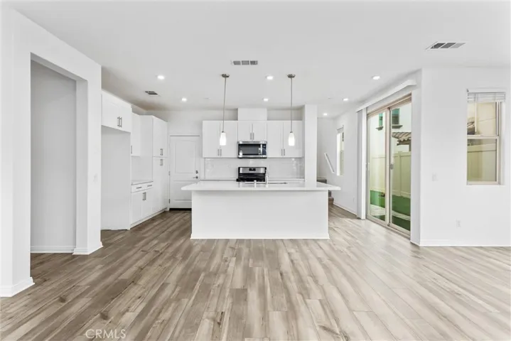 Great room combining kitchen, living, and dining