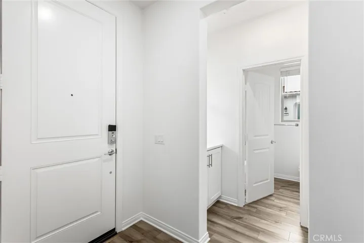 Front door, access to downstairs bedroom and bath