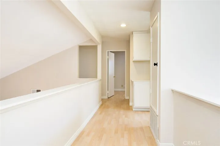 A hallway leads to the two secondary bedrooms and a share bathroom on the other side of the house.