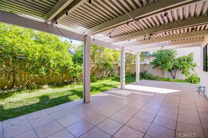 The backyard with many fruit trees including tangerine, orange, lime, grapefruit and pomegranate. You can shop in your own backyard! What a treat!