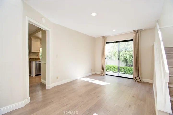 The spacious dining room with sliding door to the side yard.