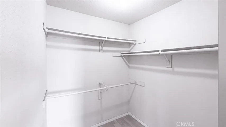The walk-in closet in the primary suite.