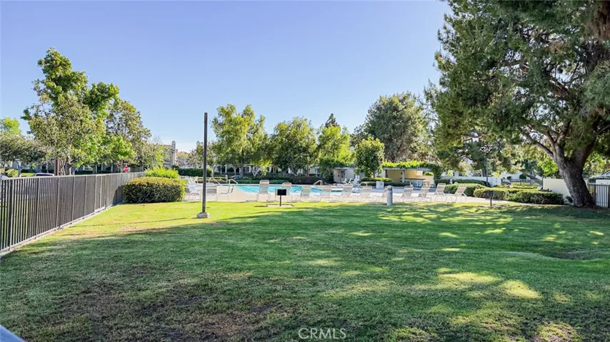 One of the 24 swimming pools in Woodbridge Village is within walking distance from the house.