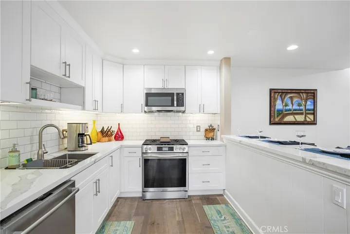 Stainless Steel Appliance's, Gas Oven, Vented Microwave, Quartz Counters.
