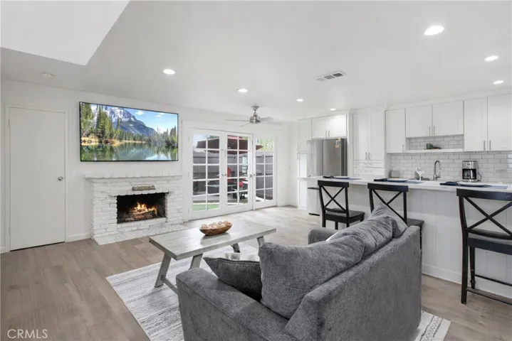 Fireplace in the family room which opens to Kitchen.
