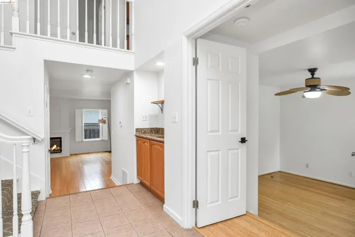 Hall featuring light wood-style flooring and baseboards