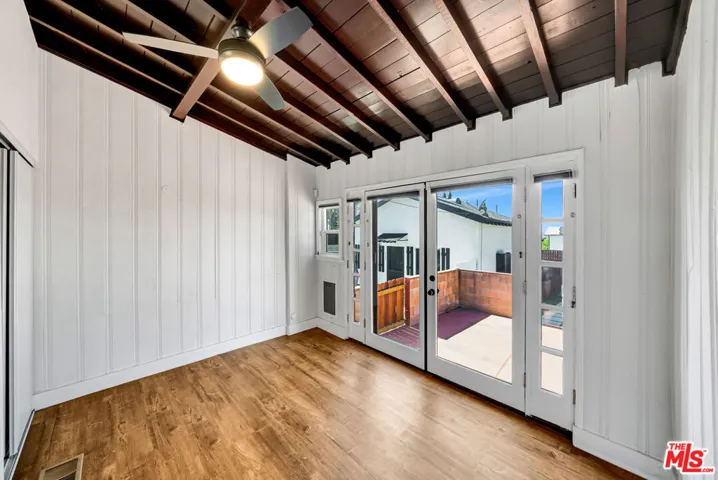 Den Open To Private Backyard