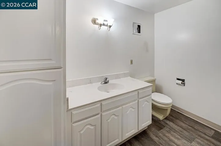 first view of bathroom with linen closet