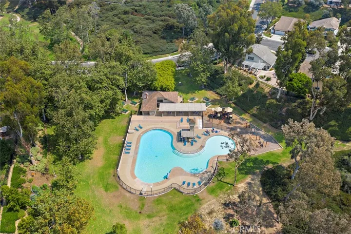 Dana Woods gated pool area with showers located next to park, BBQ area and playground