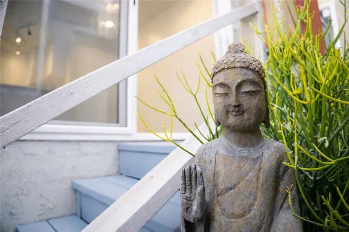 Thoughtful outdoor detail adds character and a sense of calm to the private entry.