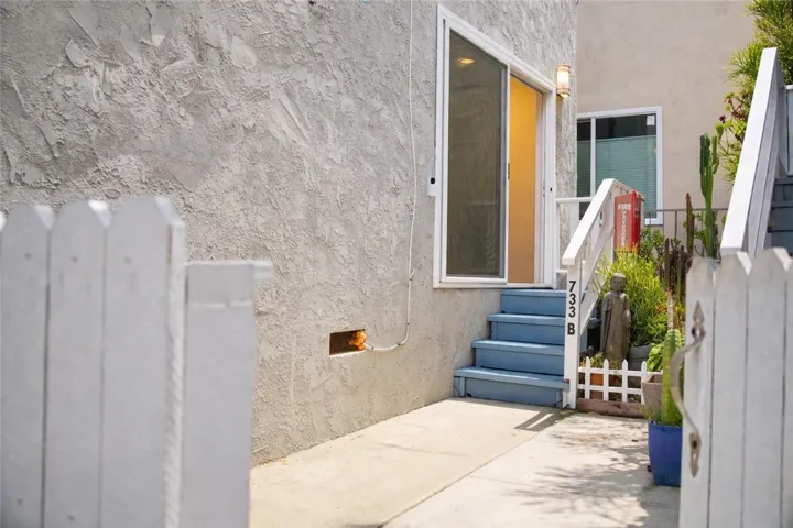 Private shared patio entry creates a welcoming arrival experience.