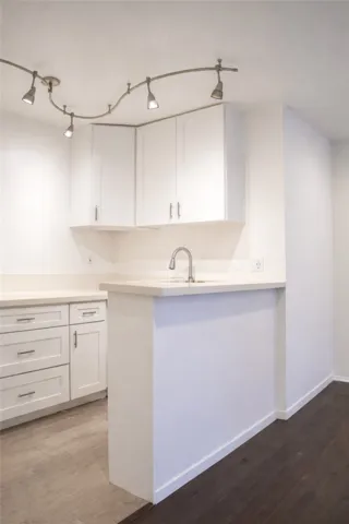Breakfast bar area providing additional counter space and storage.