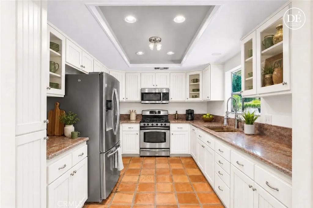 Virtually re-imagined with white painted cabinets and walls