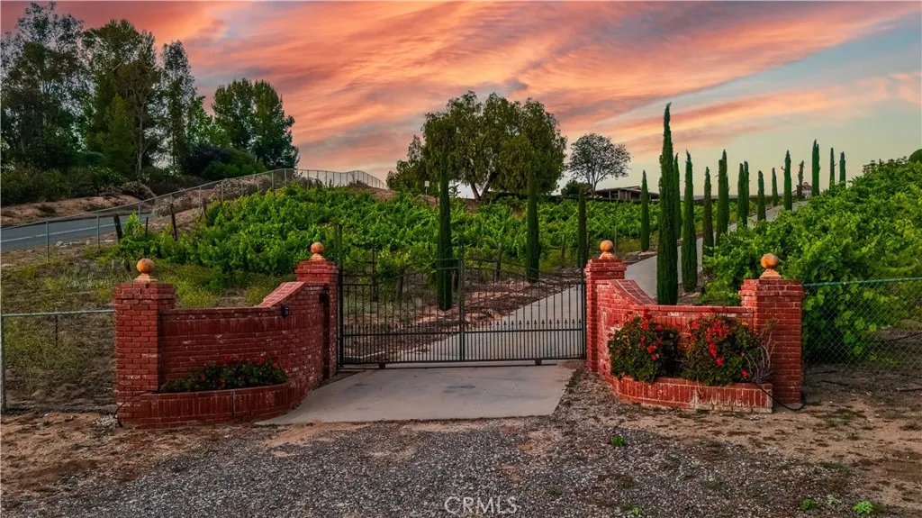 Prestigious gated entrance to main house.