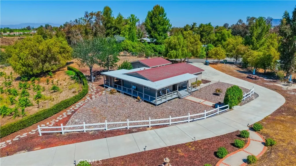 Secondary house that can be an ADU, guest house, or Airbnb. Has its own entrance and garage.