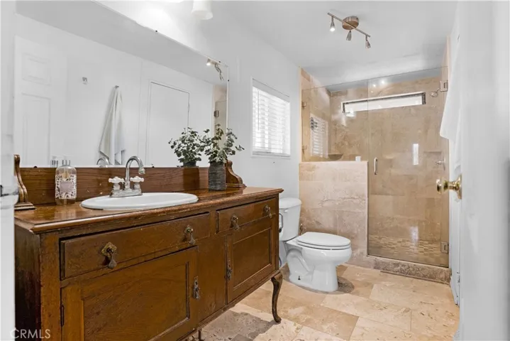 Primary bathroom has an easy step shower