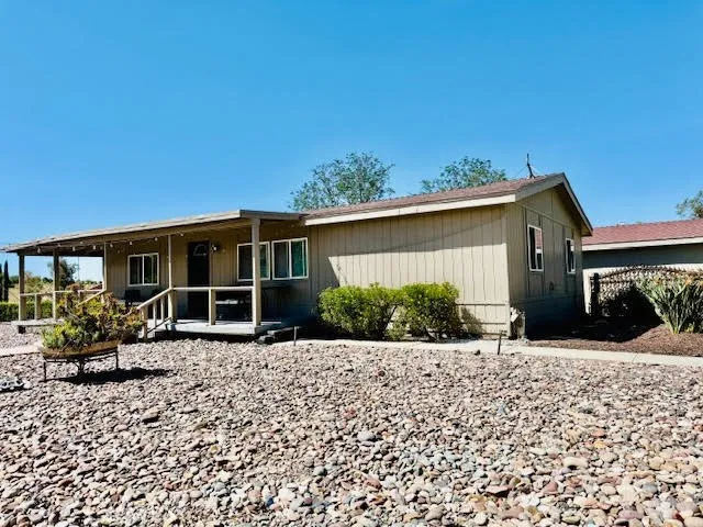 House faces the gazebo and pool area