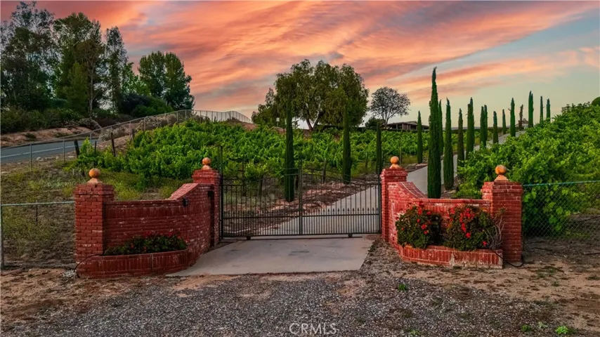 Prestigious gated entrance to main house.