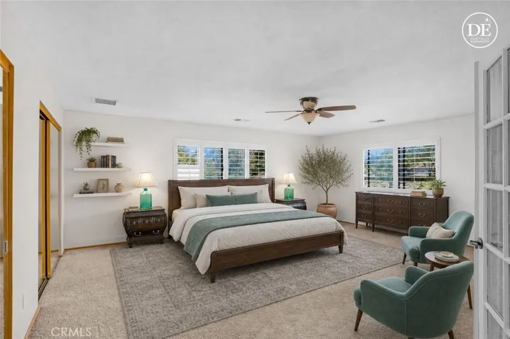 Virtually staged primary bedroom suite