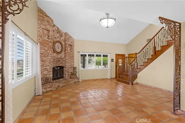 Gorgeous brick fireplace and staircase