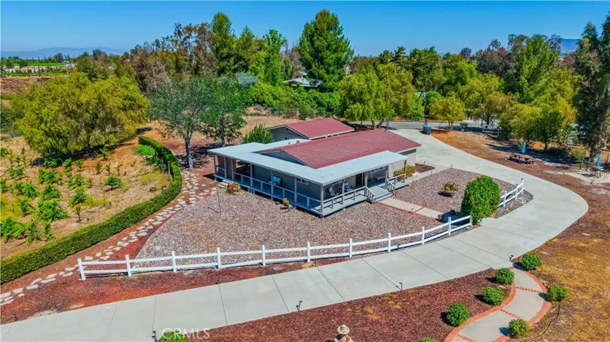 Secondary house that can be an ADU, guest house, or Airbnb. Has its own entrance and garage.