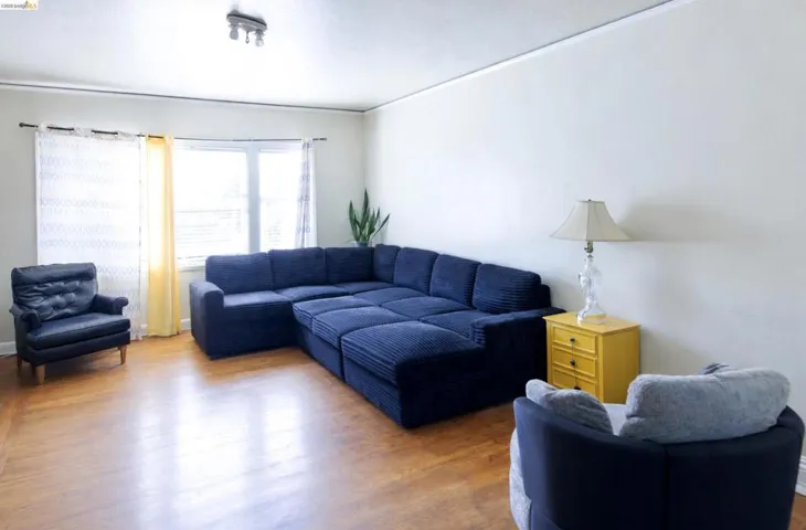 Living area featuring wood finished floors