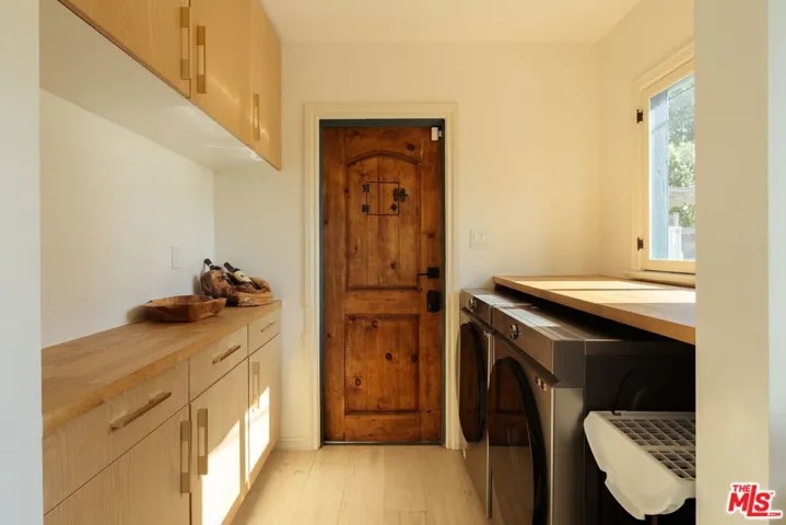 foyer with laundry area with a