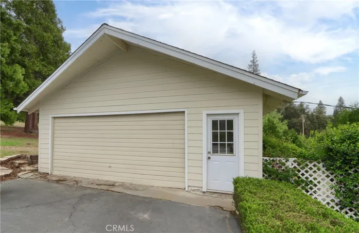 Detached 2 car garage with plenty of cabinet space.