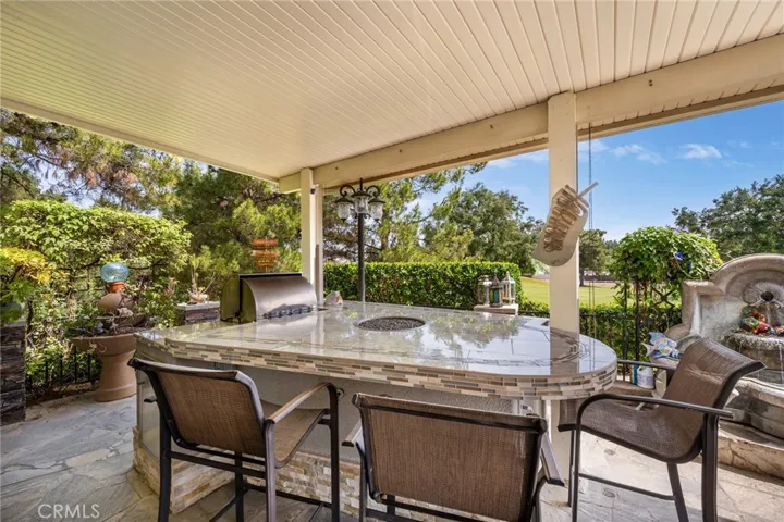 Beautiful BBQ Island with Fireplace and Covered Awning