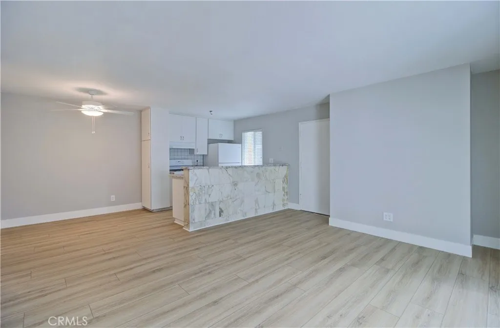 Family room looking towards kitchen, kitchen nook and front door.
