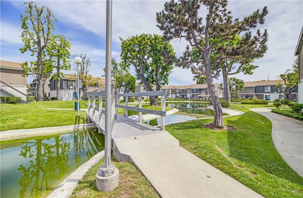 View of pond and well maintained grounds.