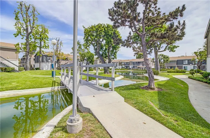 View of pond and well maintained grounds.