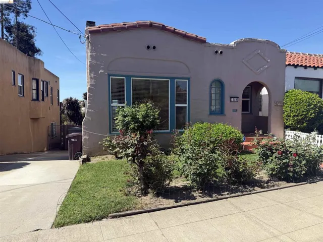 Mediterranean / spanish-style house with a tiled roof and stucco siding