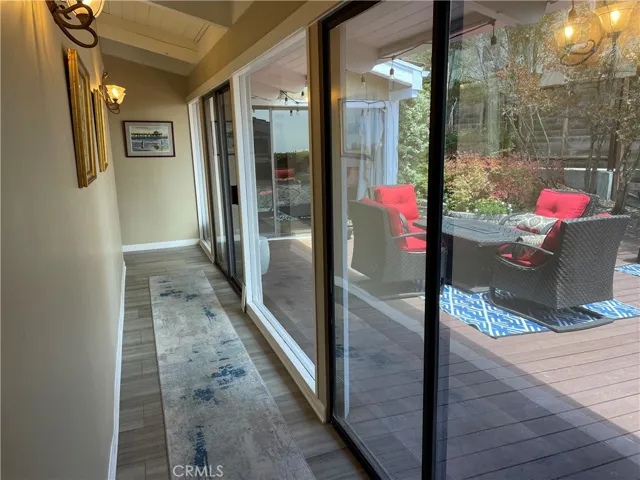 Main hall with sliders to side deck. Lots of light!!