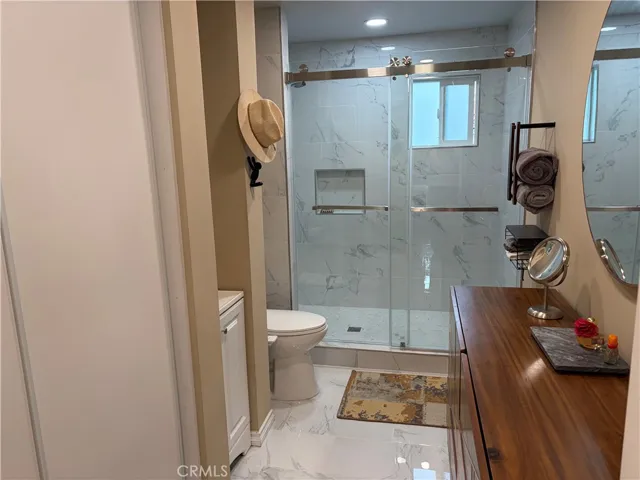 Remodeled bath off fam rm.  Perfect for guests or teenagers