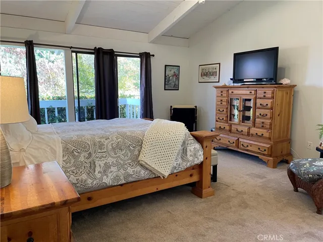 Freshly painted primary with direct access to deck AND backyard