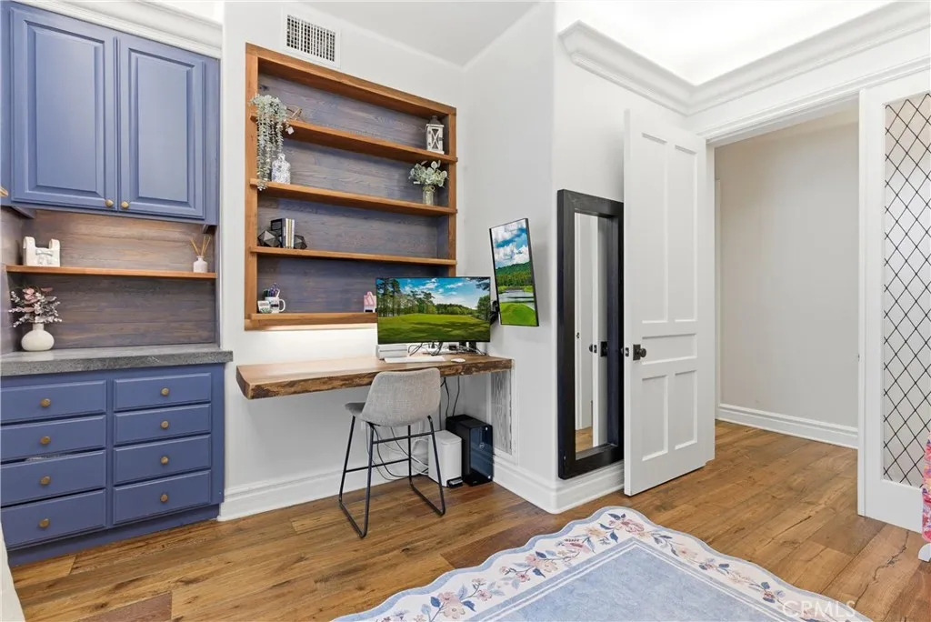 office with built-in desk and shelving