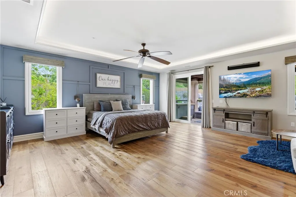 Lager primary suite that opens to private backyard with pool access through spiral staircase.