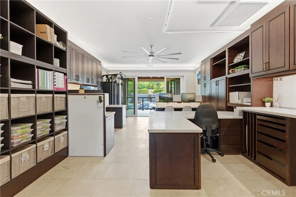 Large office with built in storage and craft table