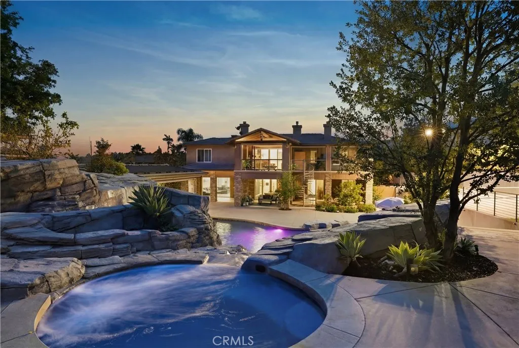 View from hot tub overlooking backyard to home.