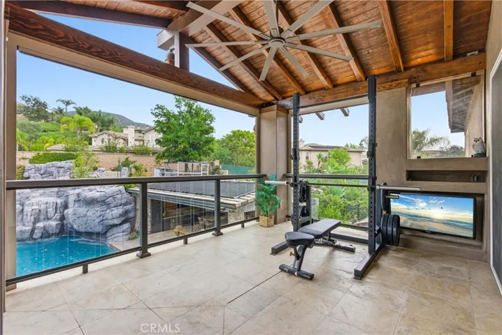 Outdoor patio extends into upstairs office, craft room.